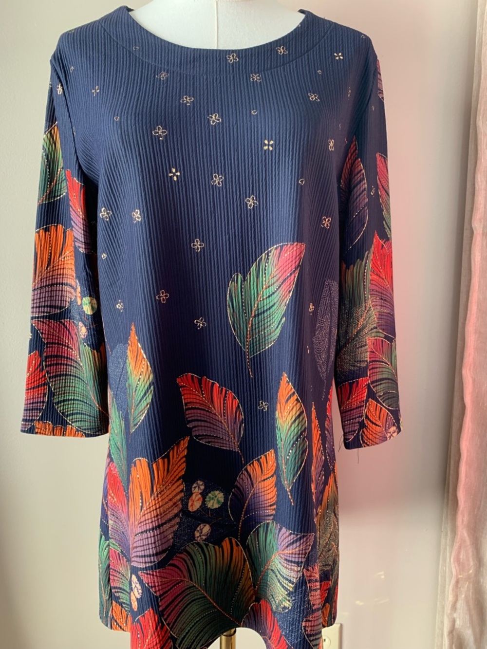 Serengeti brand navy blue dress with a metallic leaf and floral pattern.